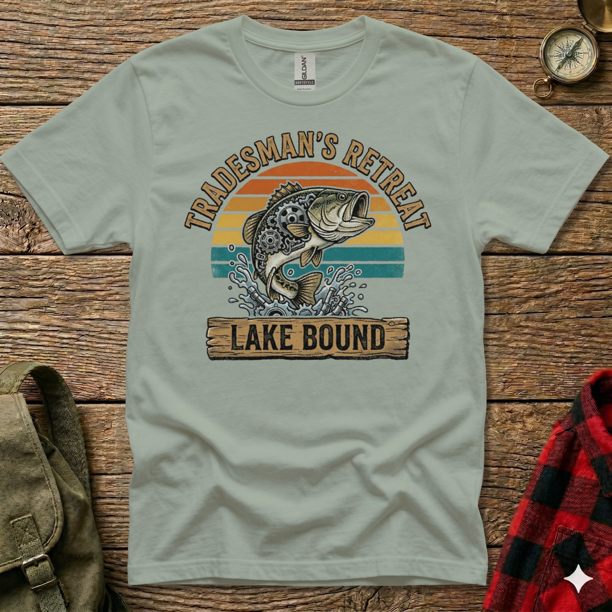 Tradesman's Retreat Lake Bound graphic tee with jumping bass and sunset.