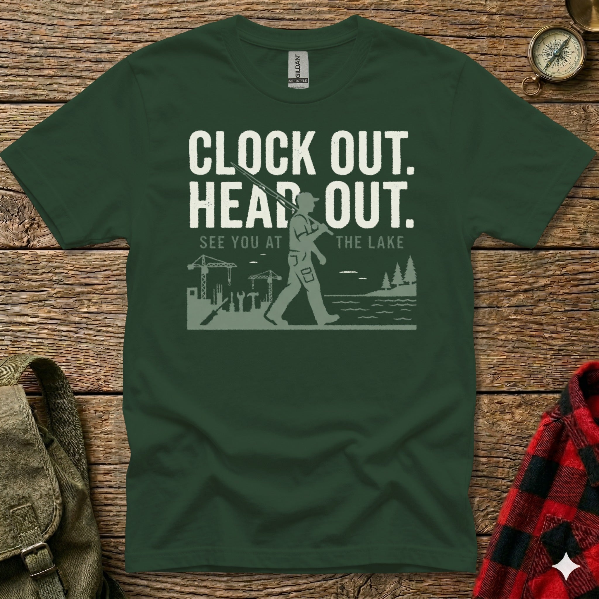 Dark green t-shirt with "CLOCK OUT. HEAD OUT. SEE YOU AT THE LAKE" text and graphic.