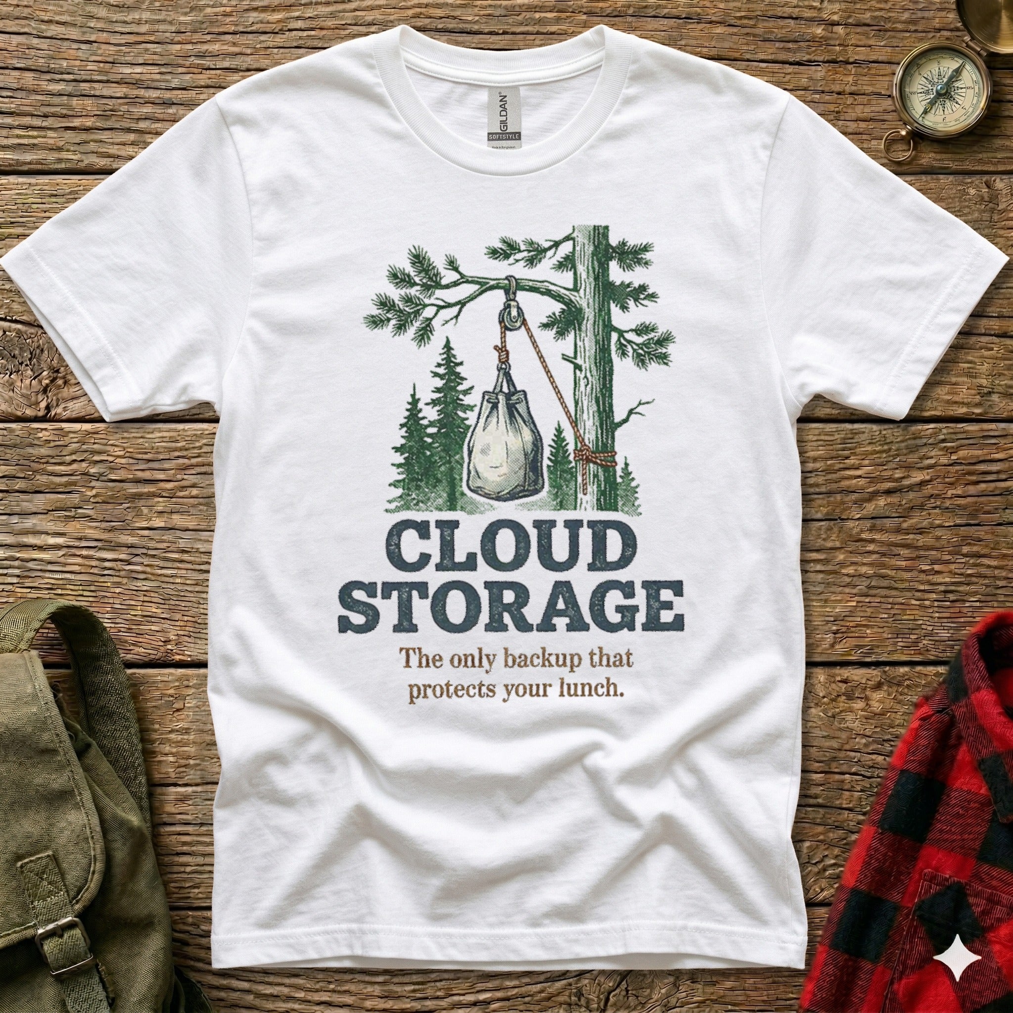 White t-shirt with "Cloud Storage" and a graphic of a lunch bag hanging from a tree.