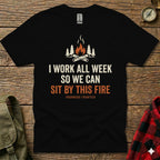 Black t-shirt with "I WORK ALL WEEK SO WE CAN SIT BY THIS FIRE" text.