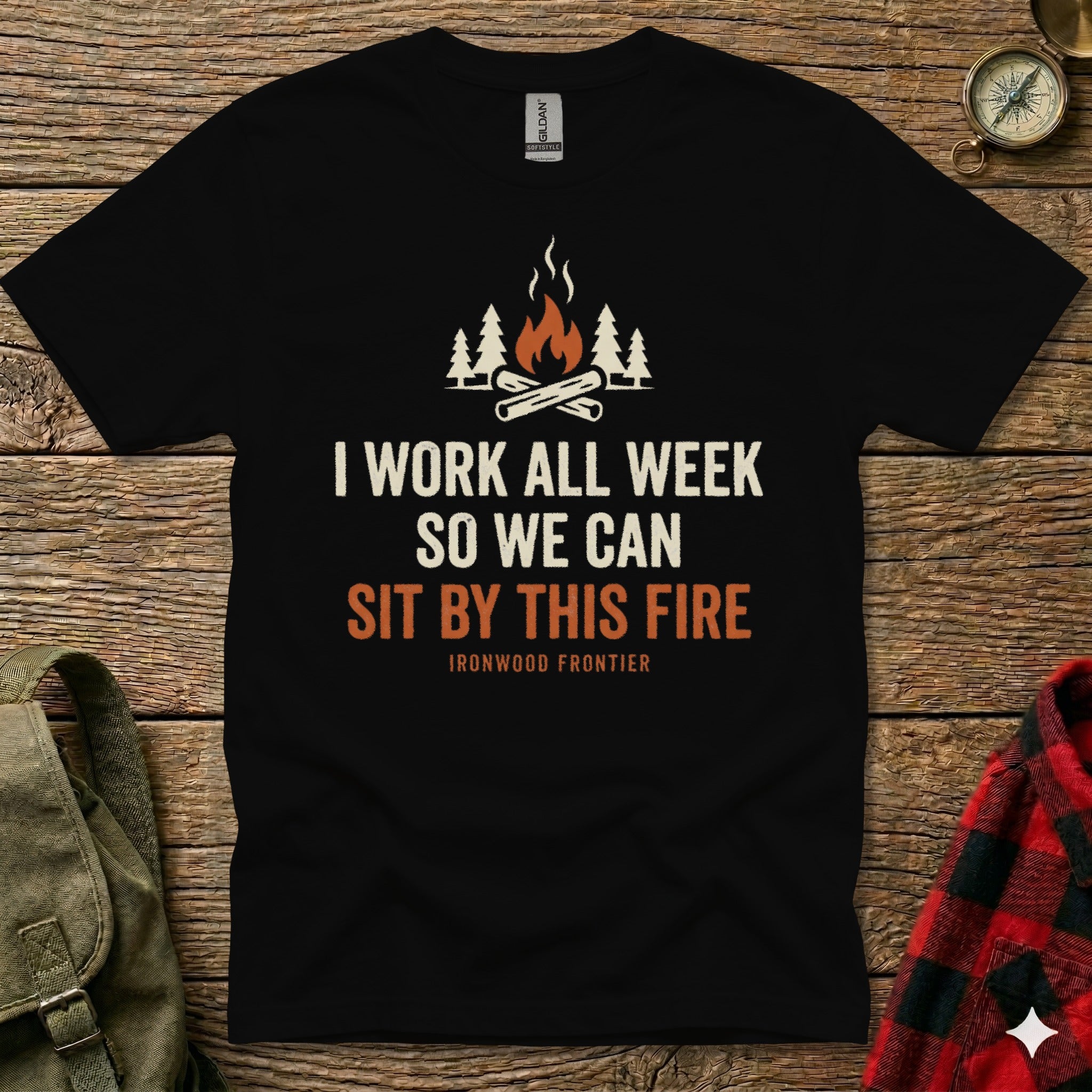 Black t-shirt with "I WORK ALL WEEK SO WE CAN SIT BY THIS FIRE" text.