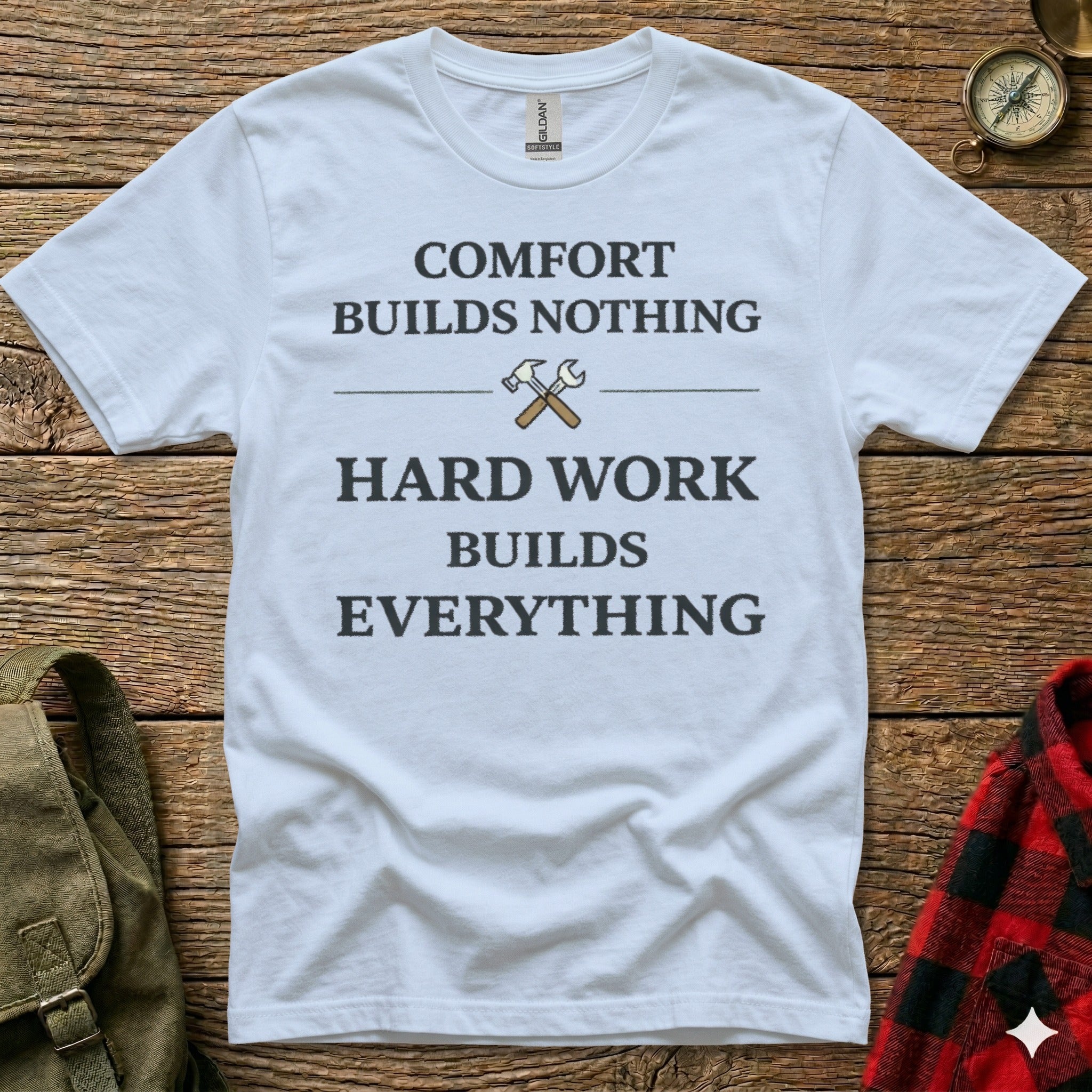 White t-shirt with "COMFORT BUILDS NOTHING HARD WORK BUILDS EVERYTHING" text.
