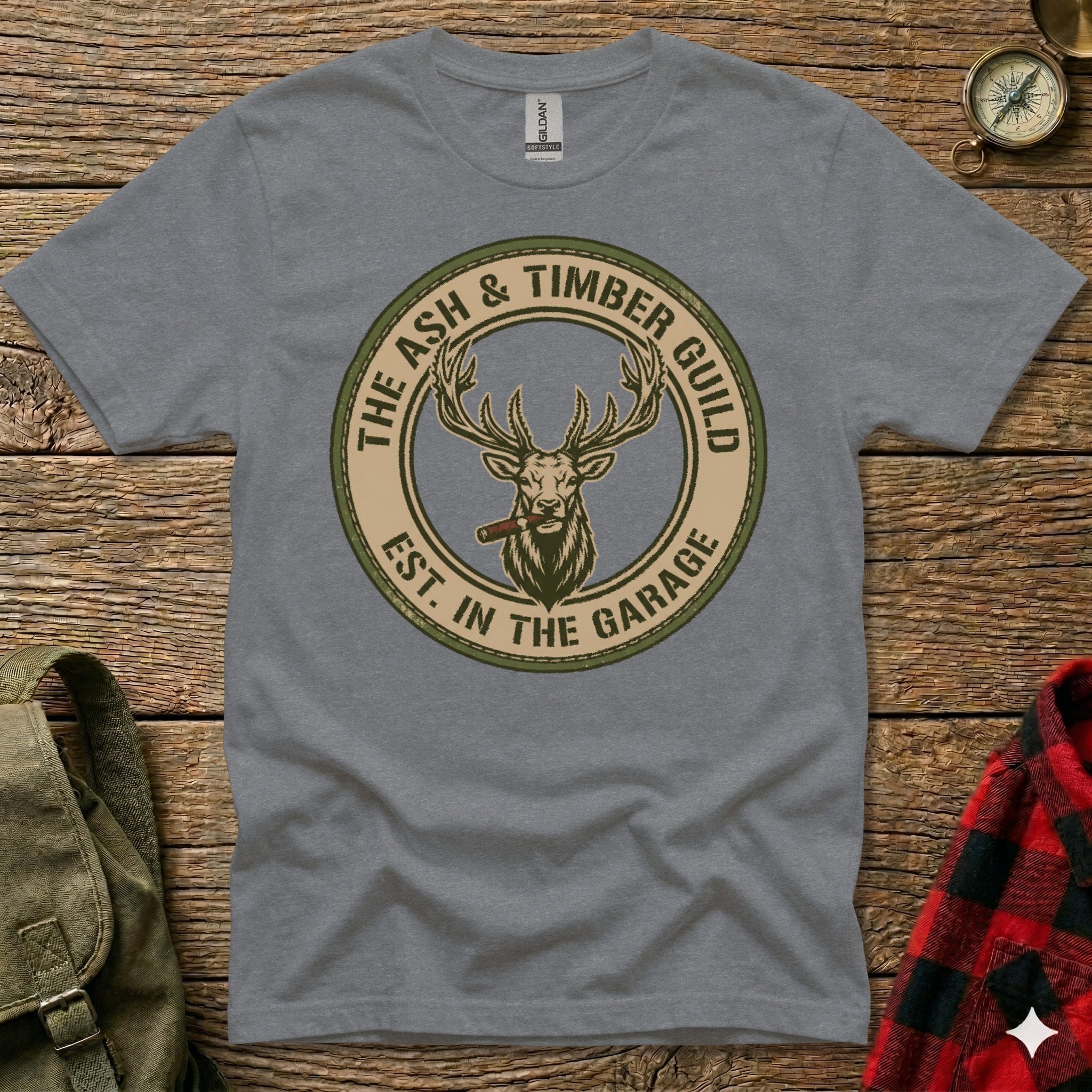 Grey t-shirt featuring a circular logo with a deer smoking a cigar.