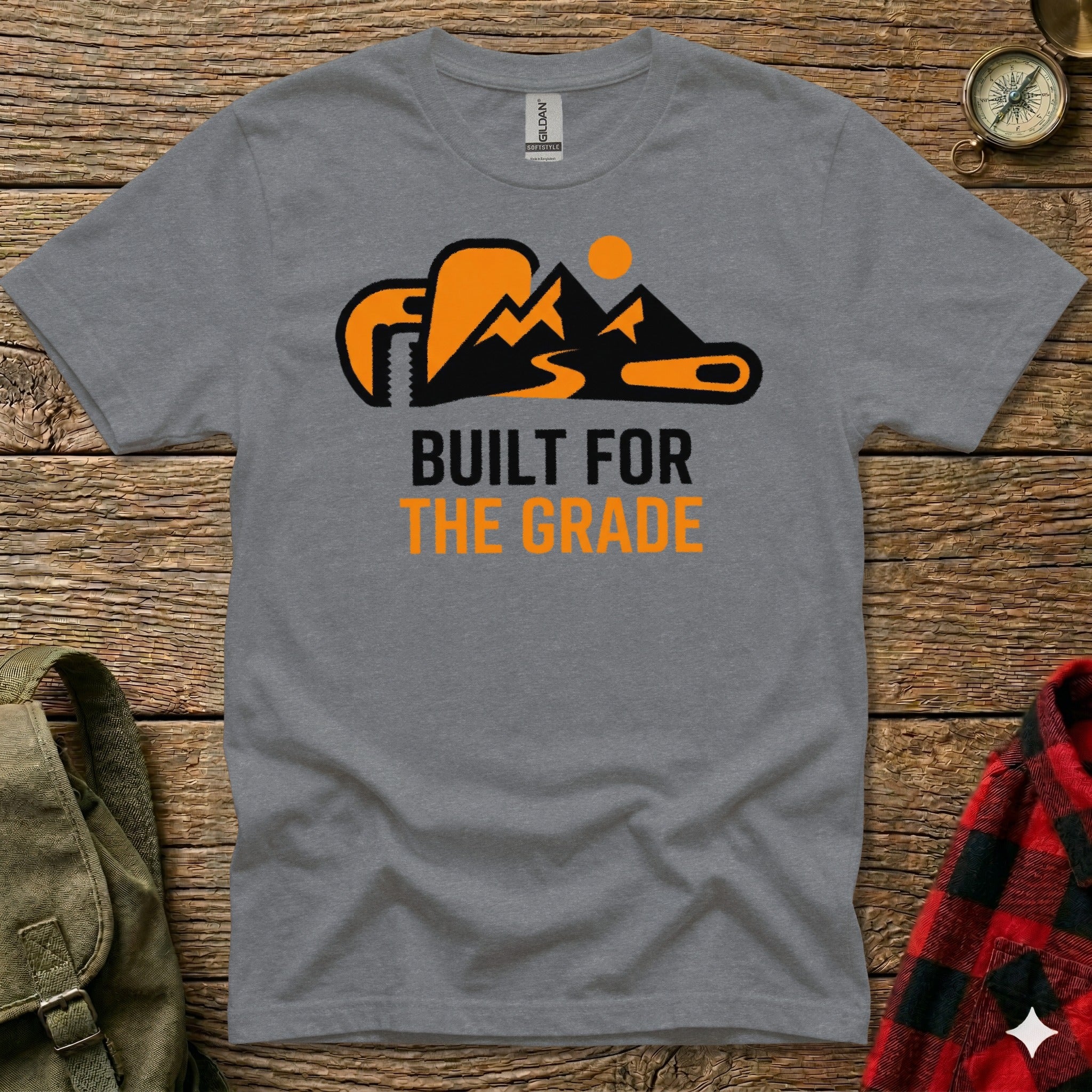 Gray t-shirt with "BUILT FOR THE GRADE" text and mountain and sun graphic.