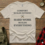 Cream t-shirt with "COMFORT BUILDS NOTHING HARD WORK BUILDS EVERYTHING" text.