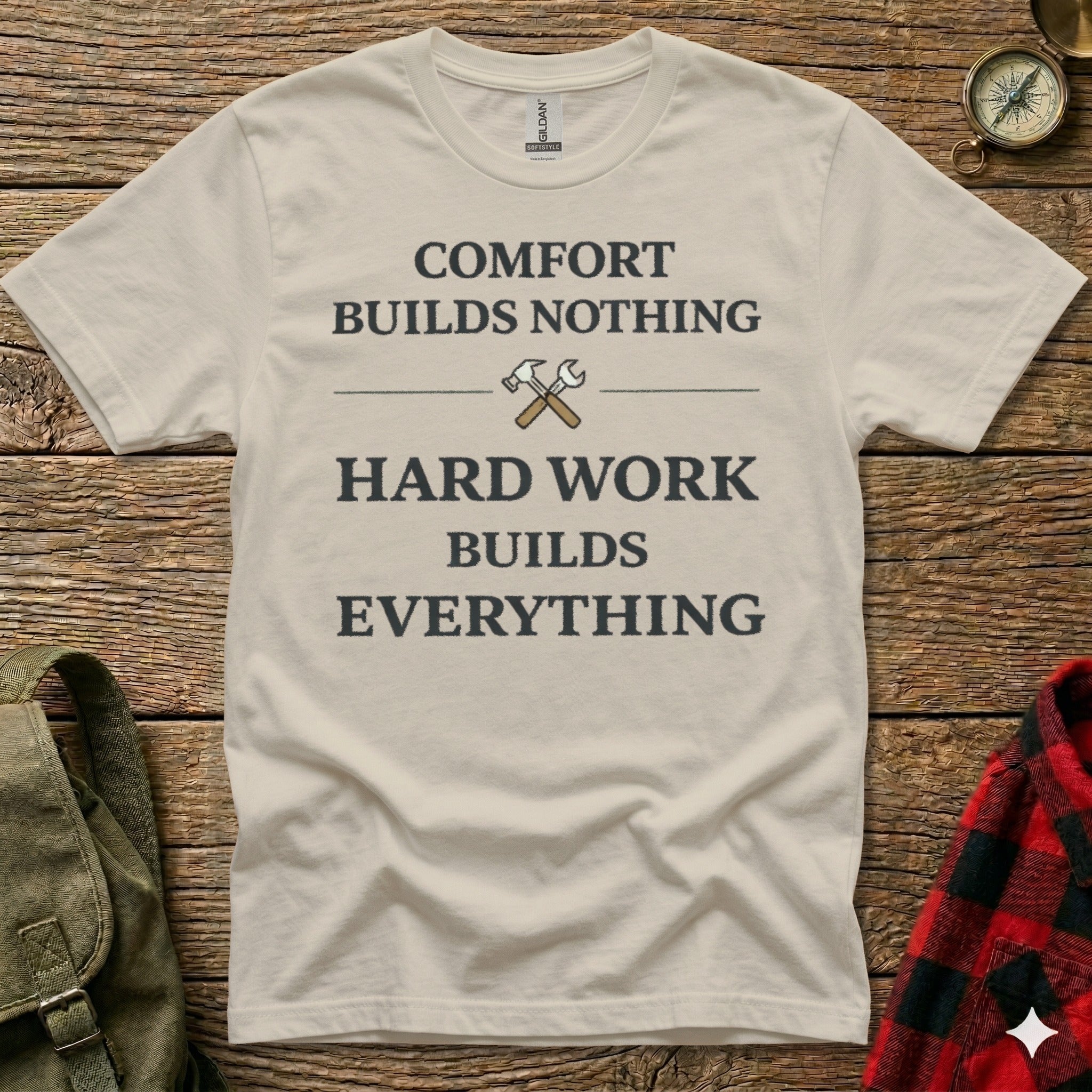 Cream t-shirt with "COMFORT BUILDS NOTHING HARD WORK BUILDS EVERYTHING" text.