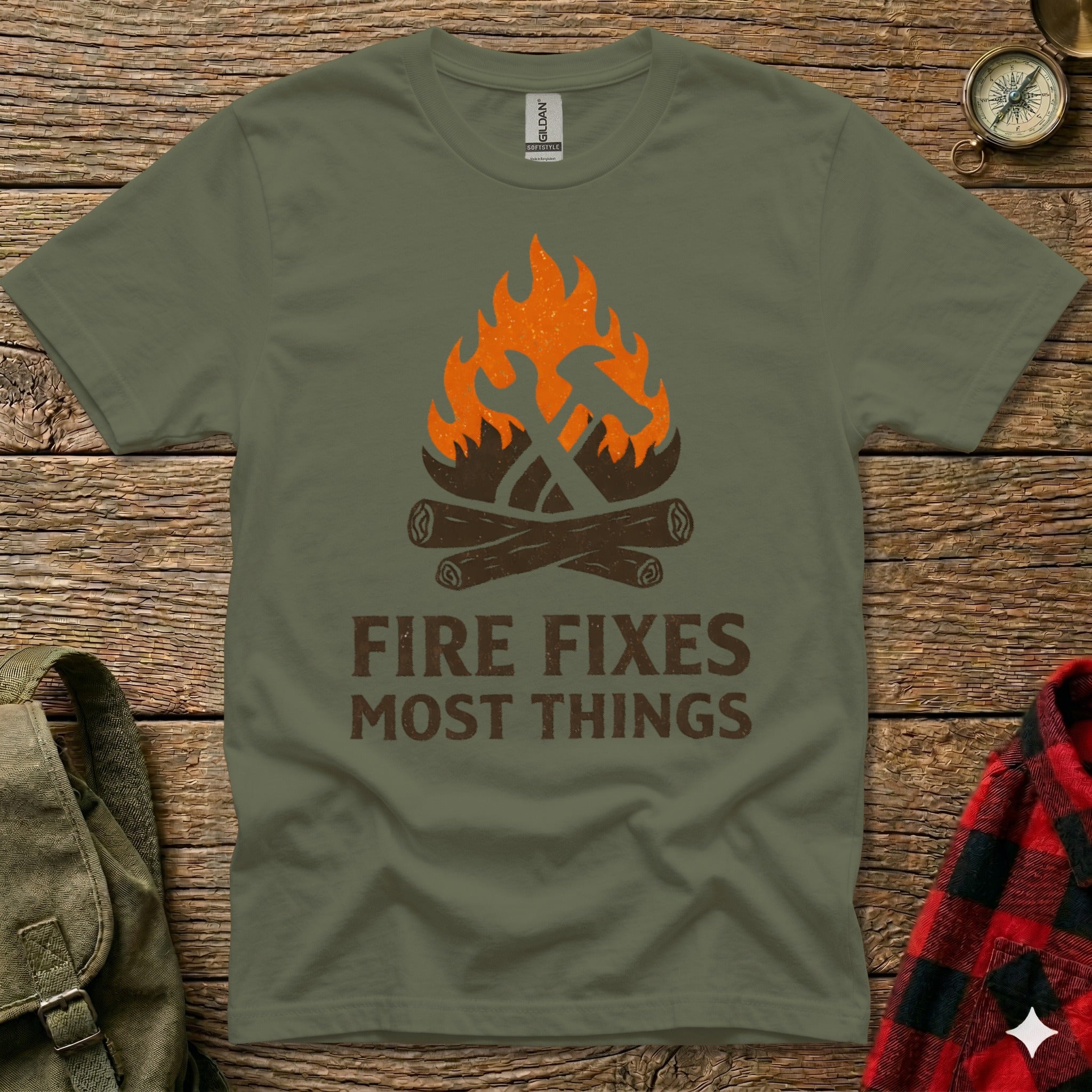 Olive green t-shirt with "FIRE FIXES MOST THINGS" and hammer/axe logo.