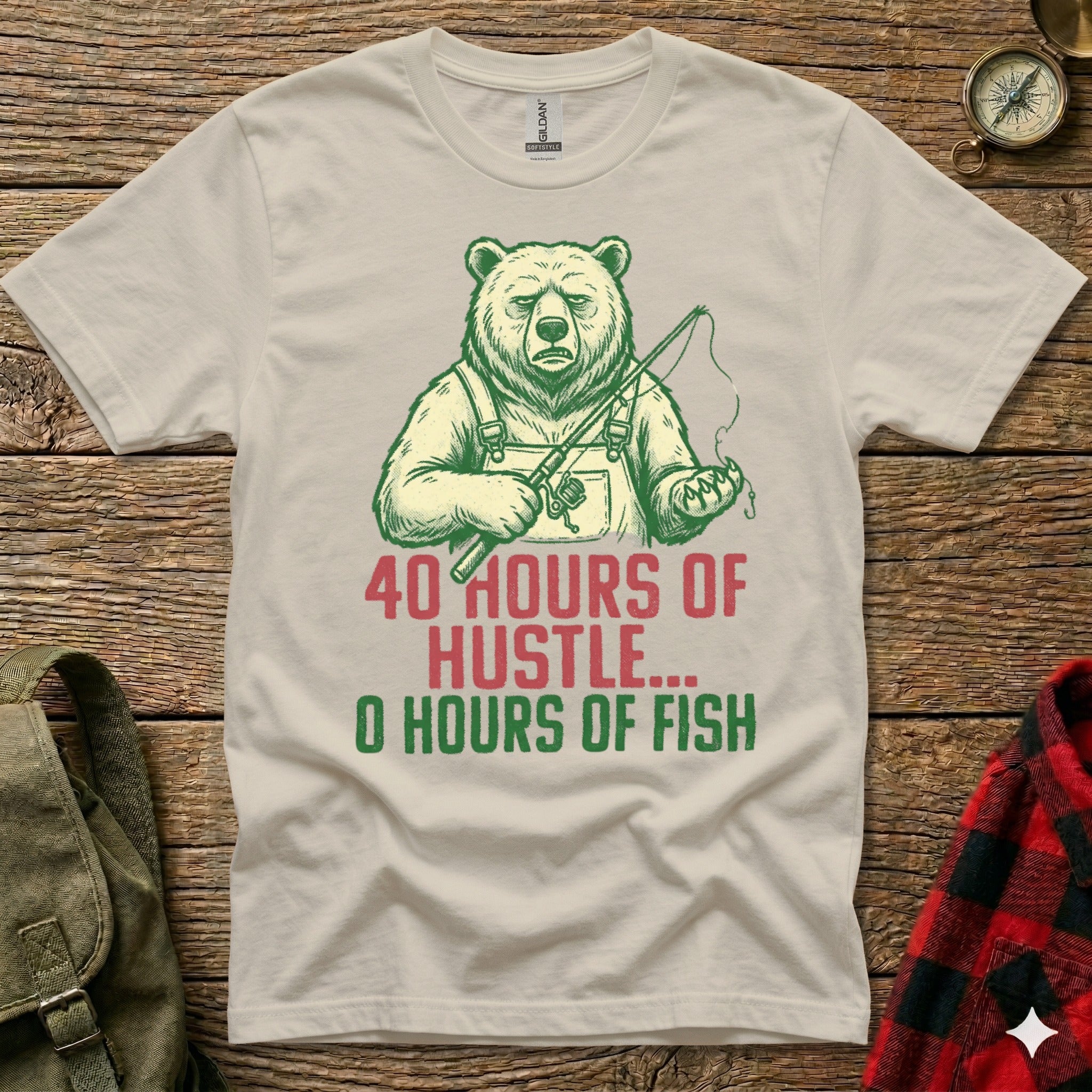 T-shirt with cartoon bear fishing and text "40 hours of hustle, 0 hours of fish".