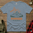 Gray t-shirt with "Forged in the Wild" text and mountain graphic.
