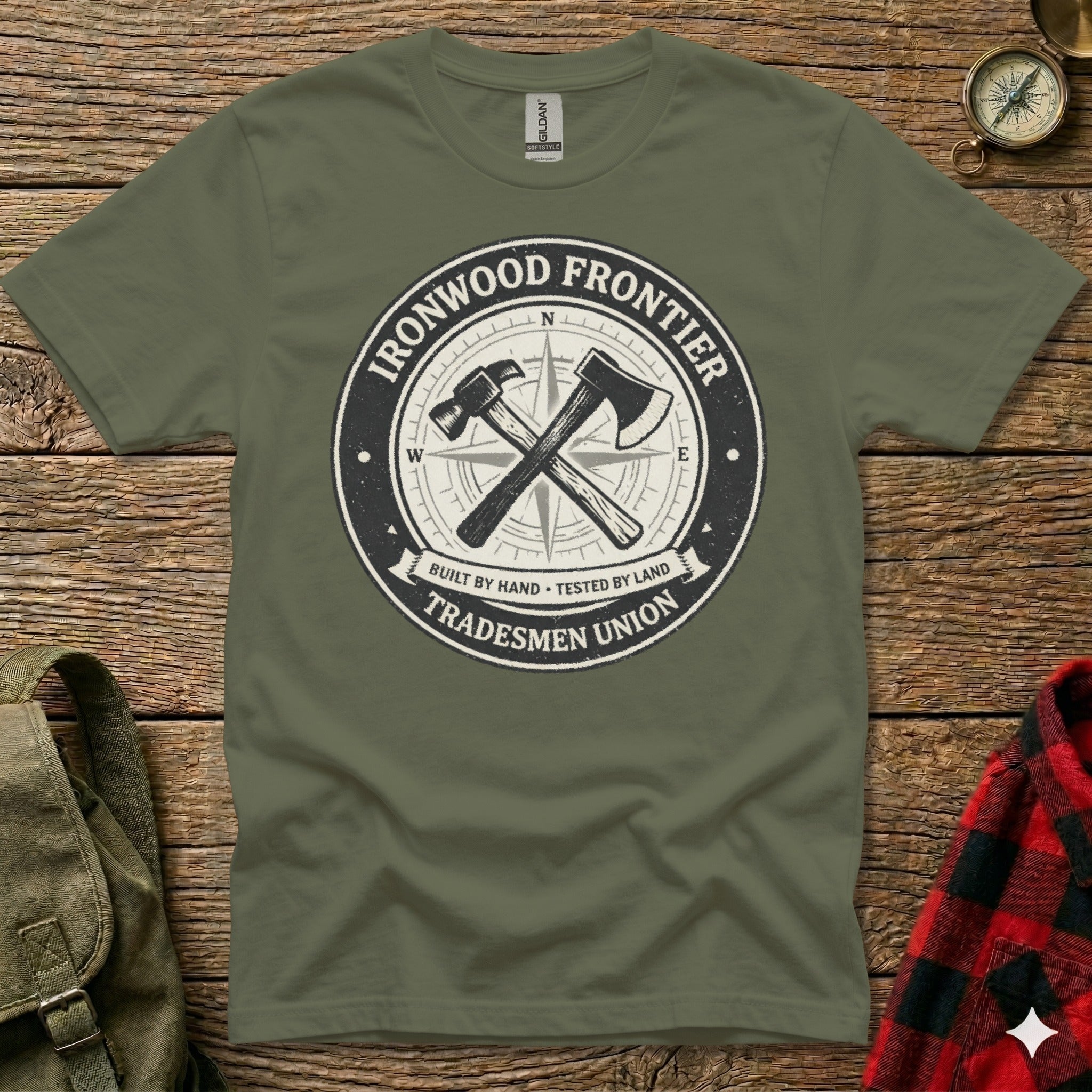 Green t-shirt with circular Ironwood Frontier Tradesmen Union logo.
