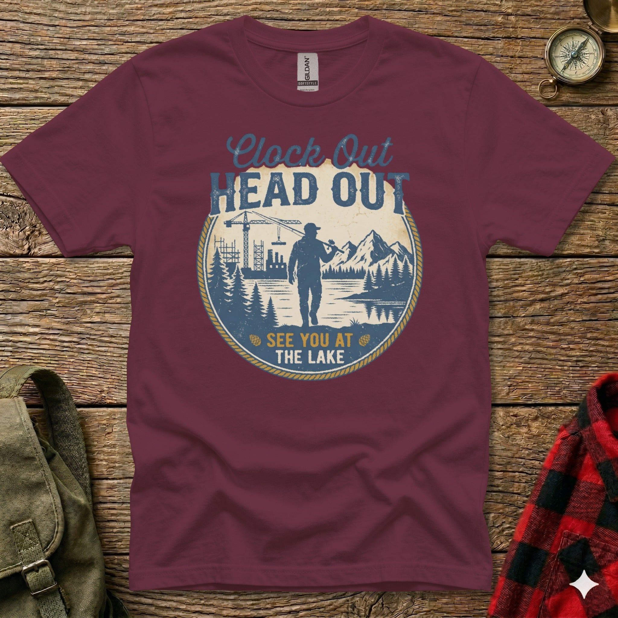 Maroon t-shirt with circular graphic "Clock Out, Head Out, See You at the Lake".