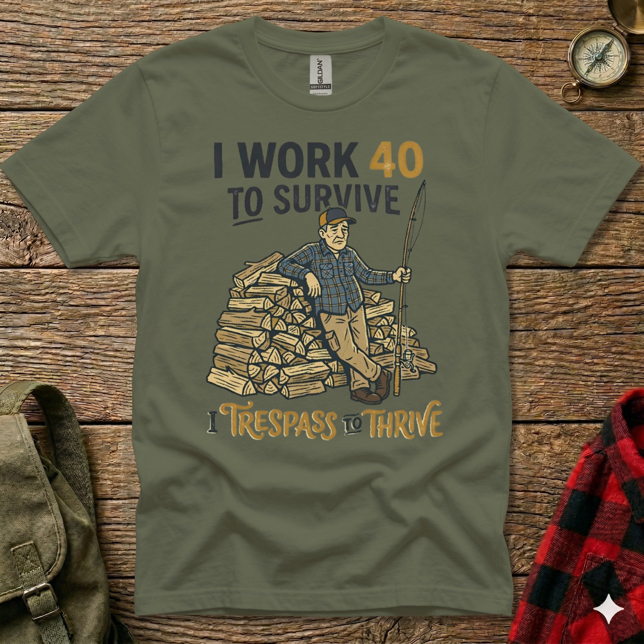 Olive t-shirt with text "I WORK 40 TO SURVIVE" and "I TRESPASS TO THRIVE".