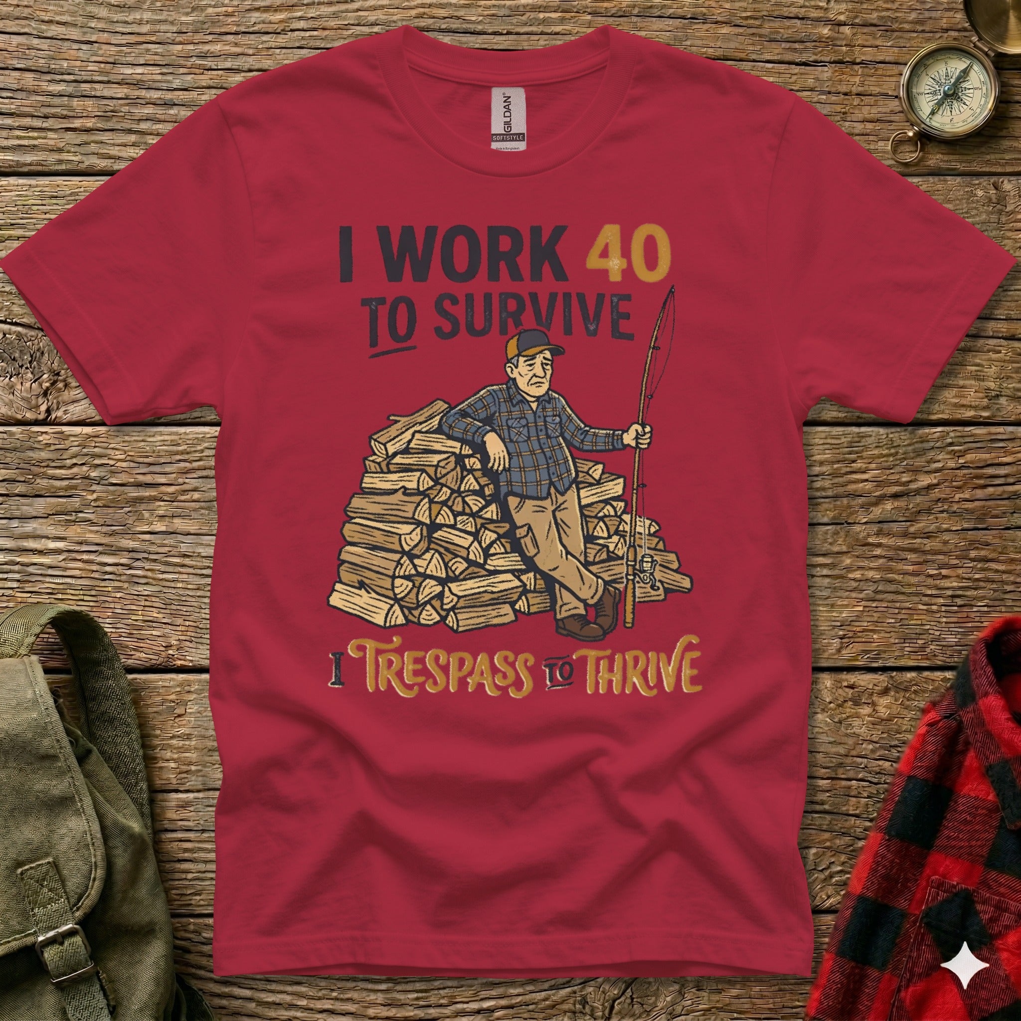 Red t-shirt with graphic of man with fishing pole and firewood.