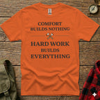 Orange t-shirt with "COMFORT BUILDS NOTHING HARD WORK BUILDS EVERYTHING" text.