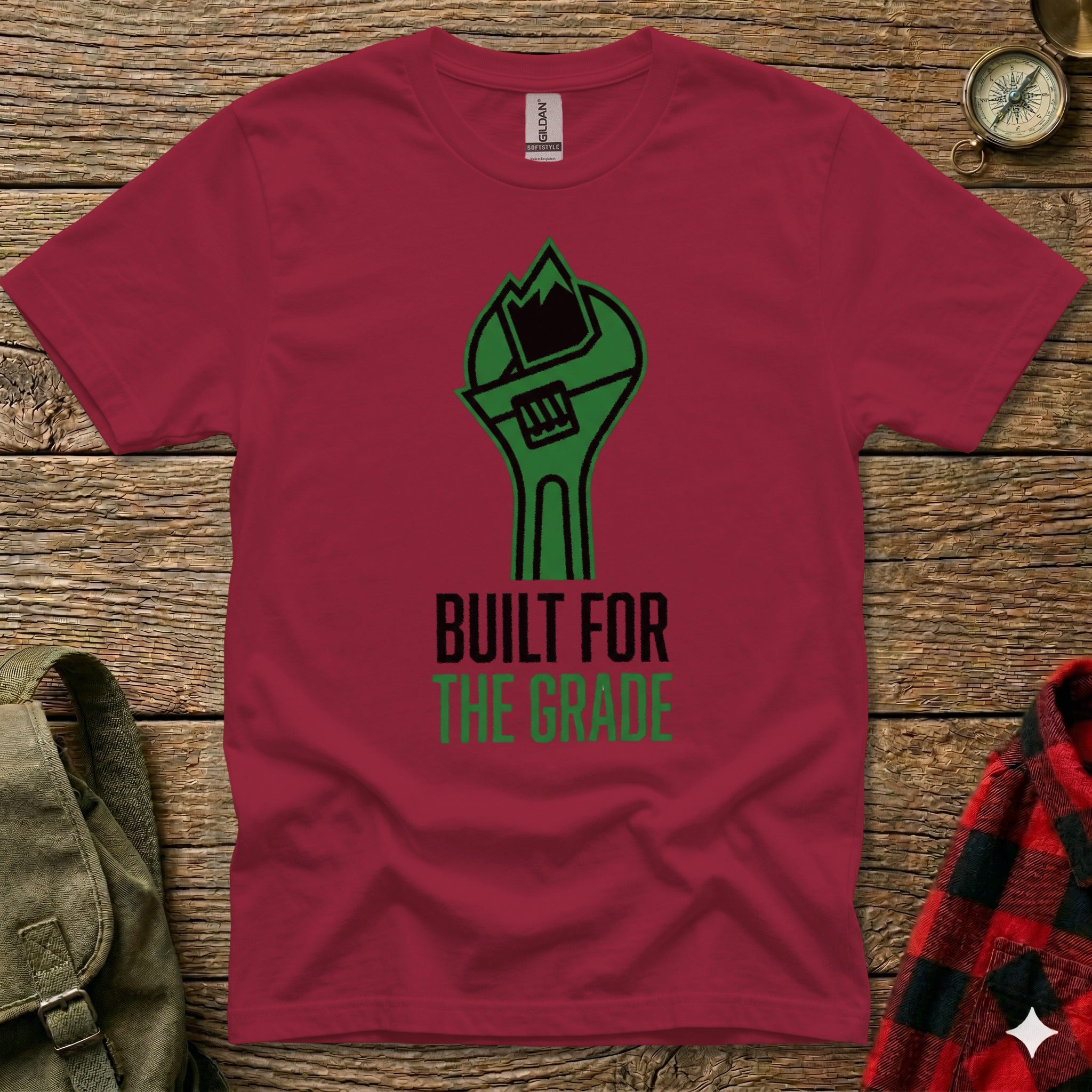 Maroon t-shirt with green wrench graphic and text "BUILT FOR THE GRADE".