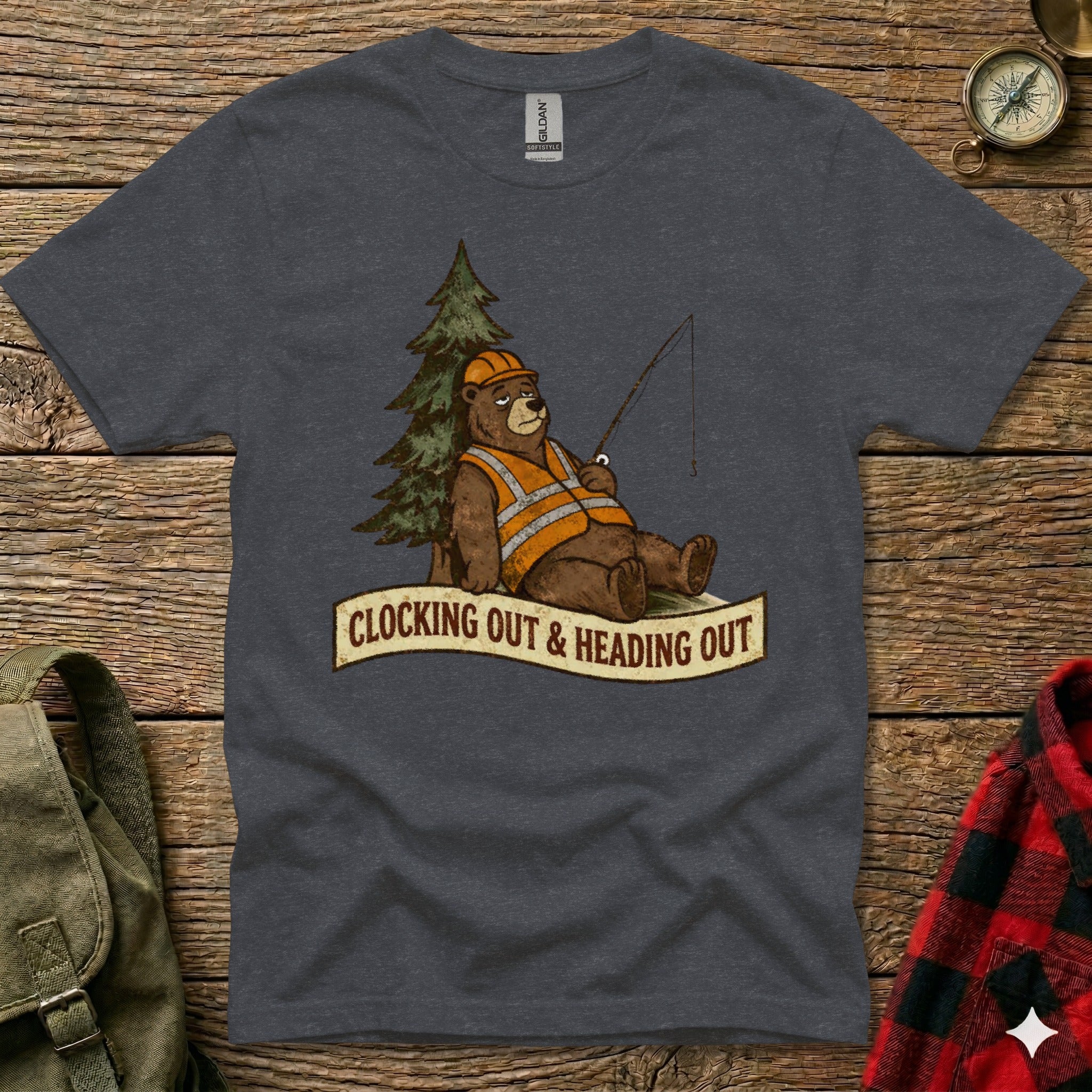 T-shirt graphic of a bear in a hard hat and vest fishing, with text "Clocking Out & Heading Out".