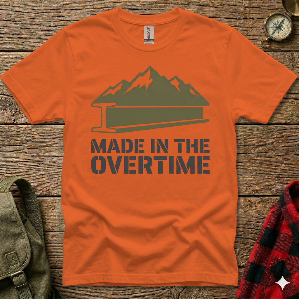 Orange t-shirt with mountain and I-beam graphic, text "MADE IN THE OVERTIME".