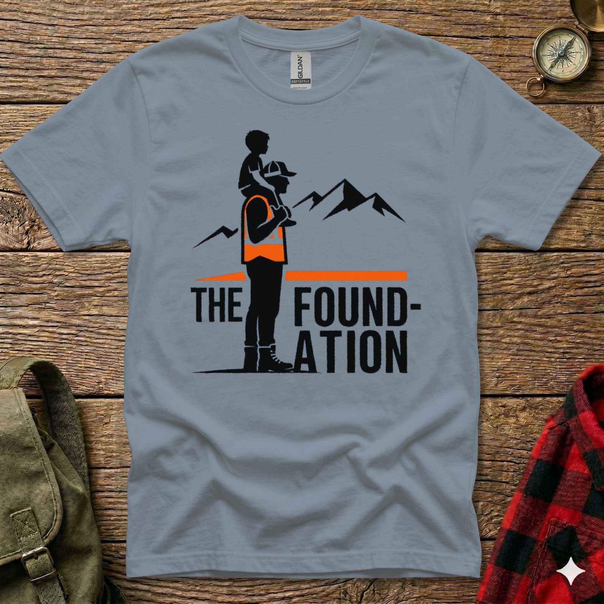 Man carrying child on shoulders in front of mountains, with "THE FOUNDATION" text.