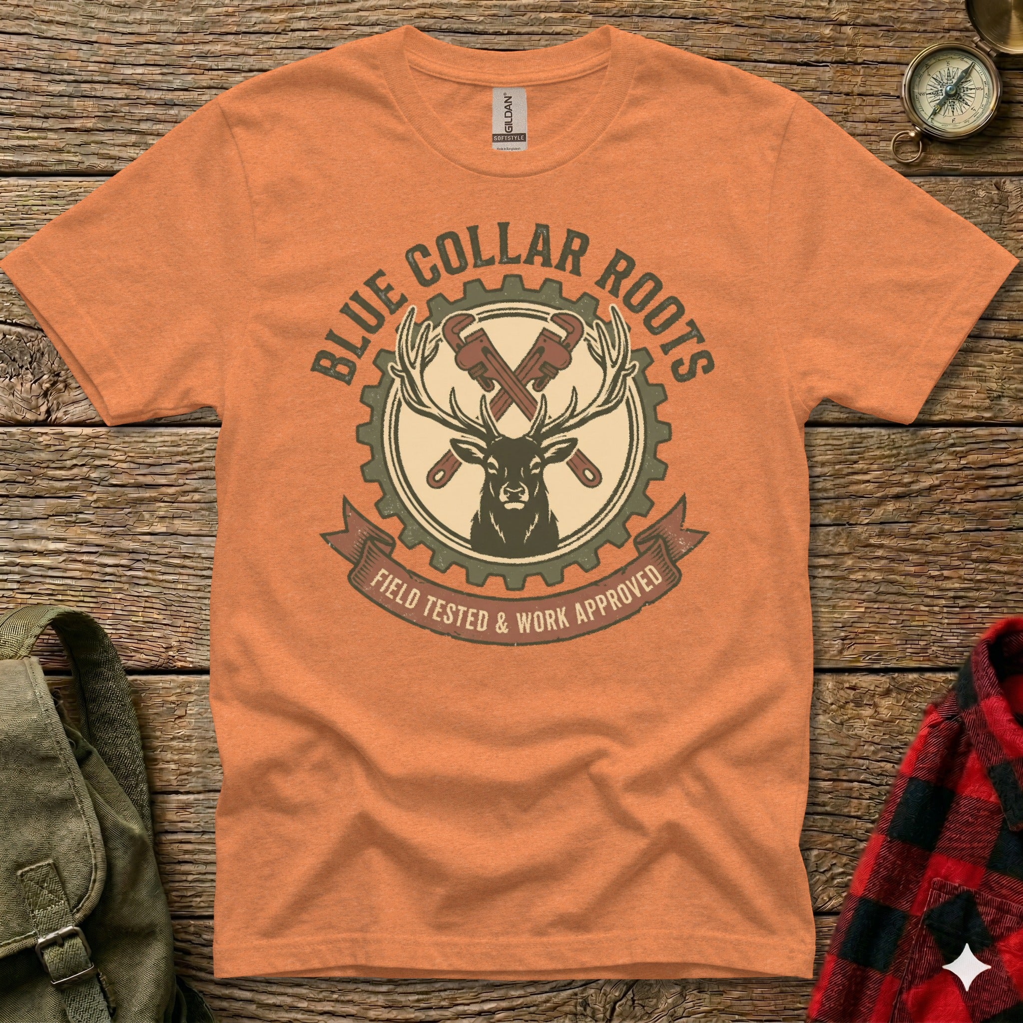 Orange t-shirt with "Blue Collar Roots" and deer logo.
