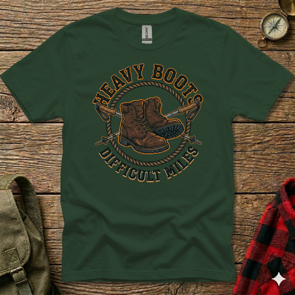 Green t-shirt with "Heavy Boots Difficult Miles" and boot graphic.