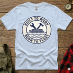 Light blue t-shirt with "Built to Work Born to Float" circular logo.