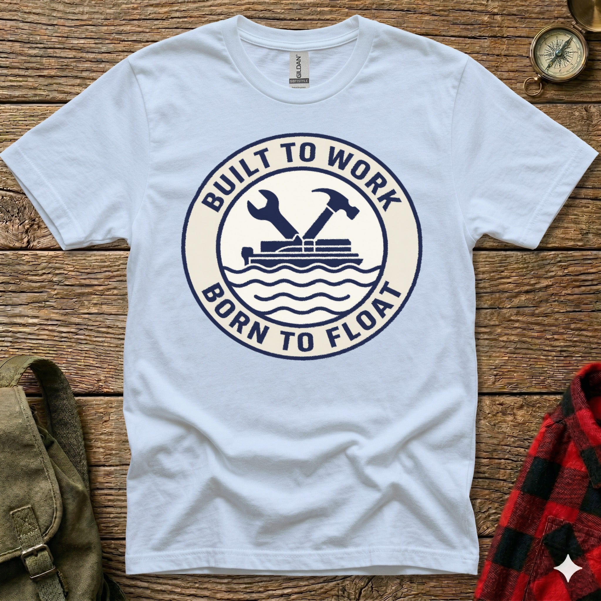 Light blue t-shirt with "Built to Work Born to Float" circular logo.