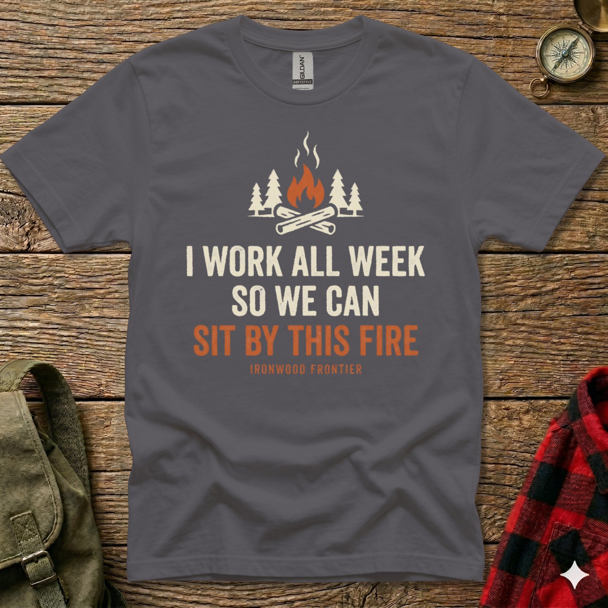 Gray t-shirt with text "I work all week so we can sit by this fire"