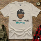 Cream t-shirt with "Vacation Mode: Engaged" text and construction hard hat graphic.