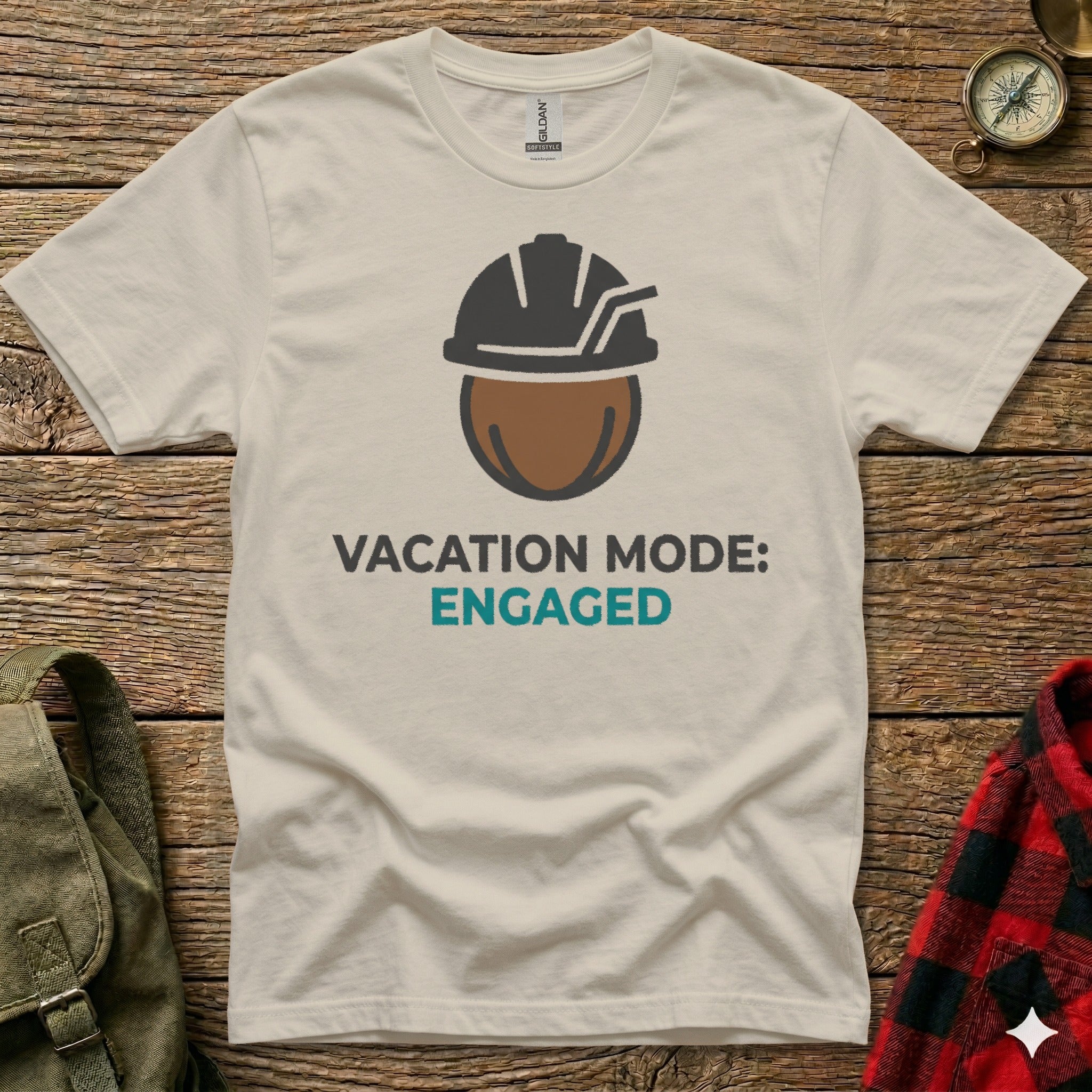 Cream t-shirt with "Vacation Mode: Engaged" text and construction hard hat graphic.