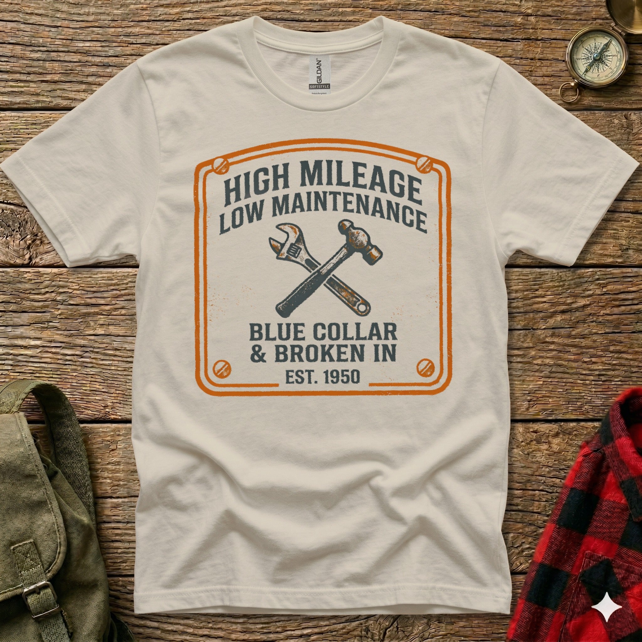 White t-shirt with "High Mileage Low Maintenance Blue Collar & Broken In Est. 1950" graphic.