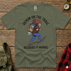 Olive green t-shirt with graphic of hiker and text "DENIM ON THE TRAIL BECAUSE IT WORKS".