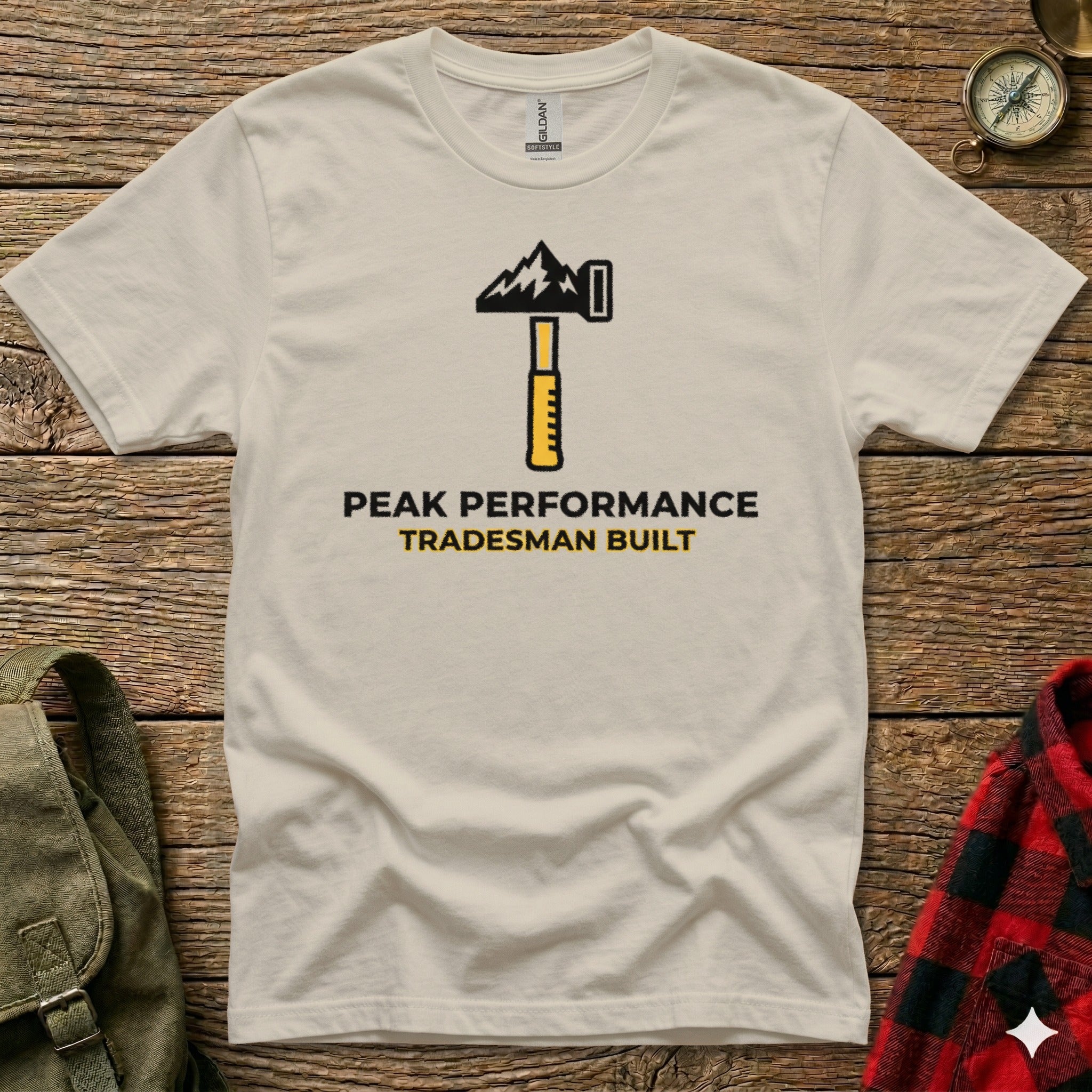 White t-shirt with "Peak Performance Tradesman Built" logo featuring a hammer.