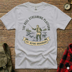 T-shirt with graphic "The Reel Streaming Platform Est. Before Broadband" and fisherman design.