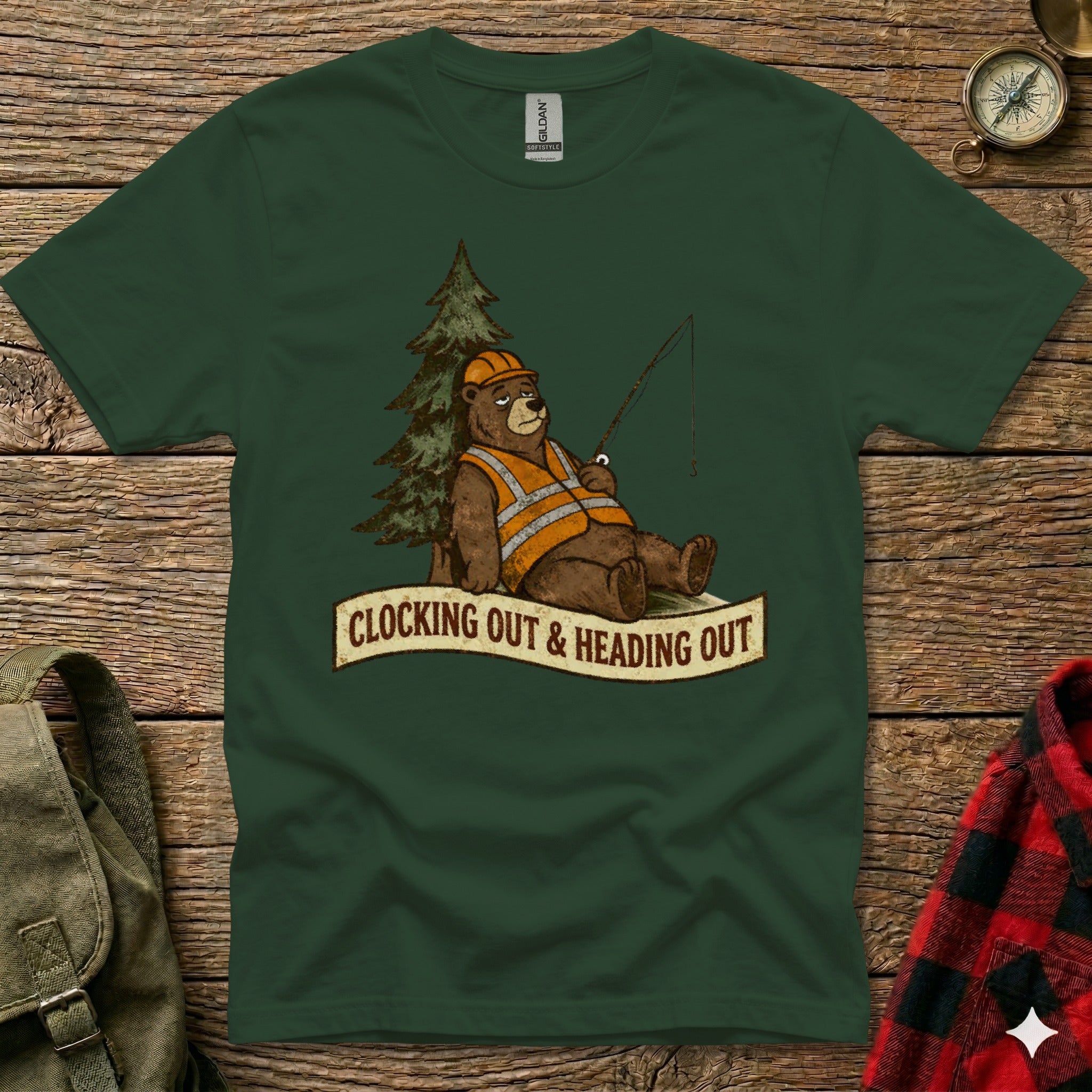 Bear wearing hard hat and vest fishes by tree with text "Clocking Out & Heading Out".