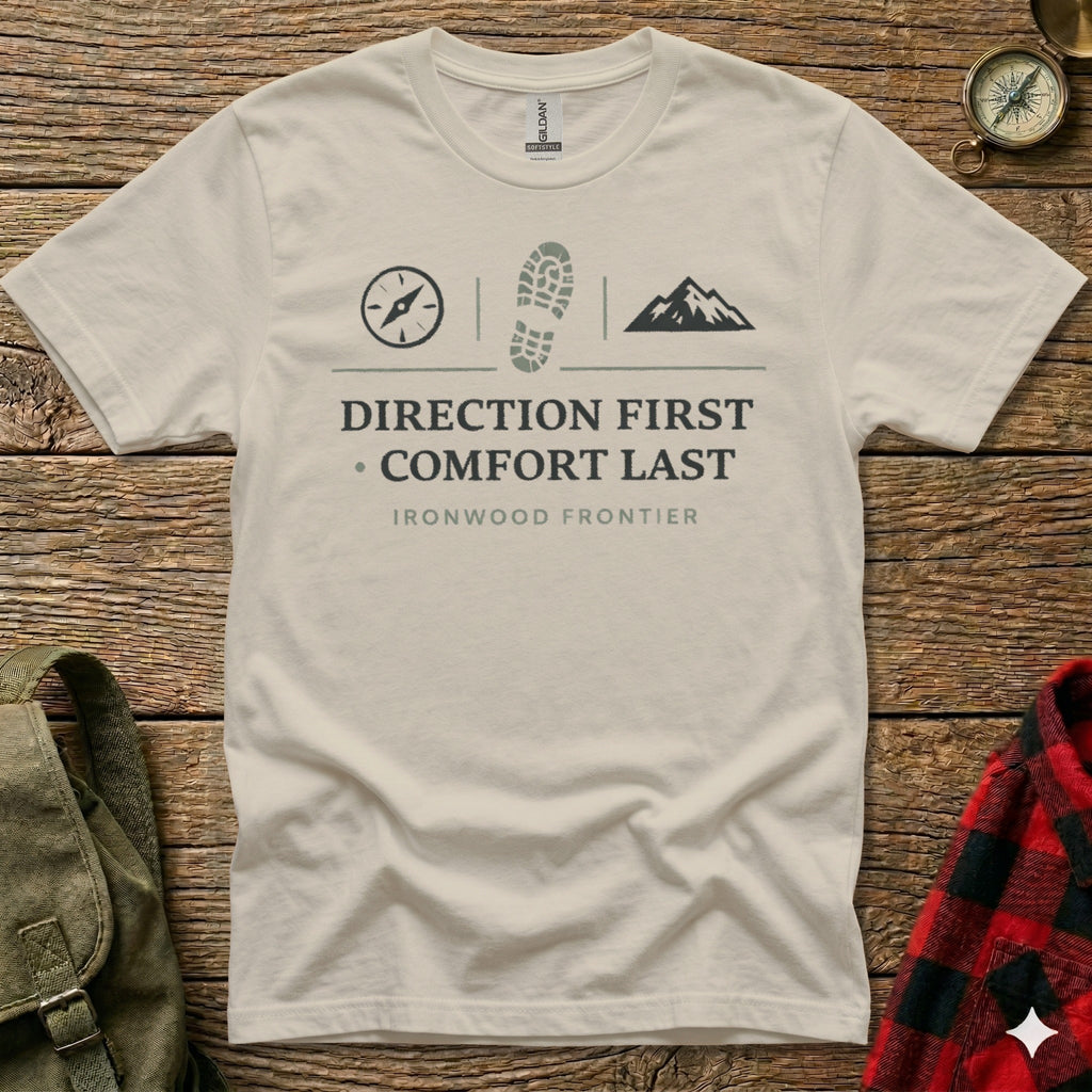 T-shirt with "DIRECTION FIRST COMFORT LAST" and mountain and boot print graphics.