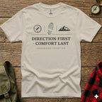 T-shirt with "DIRECTION FIRST COMFORT LAST" and mountain and boot print graphics.