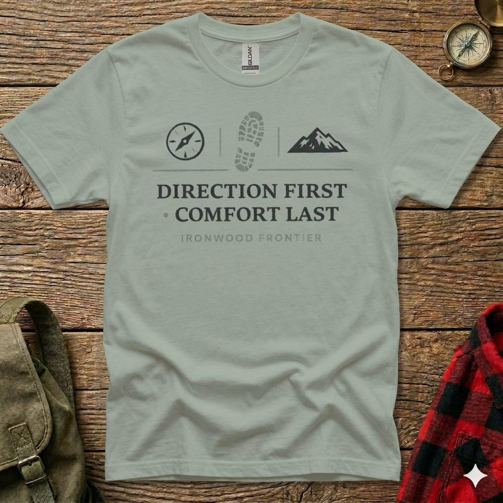 T-shirt with compass, boot print, mountain graphics and "Direction First Comfort Last" text.