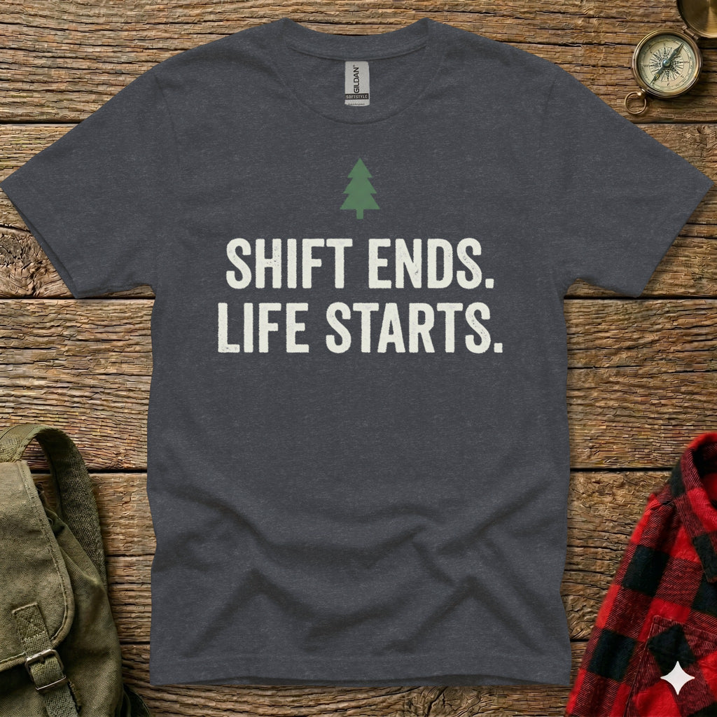 Dark grey t-shirt with white text "SHIFT ENDS. LIFE STARTS." and a green tree icon.