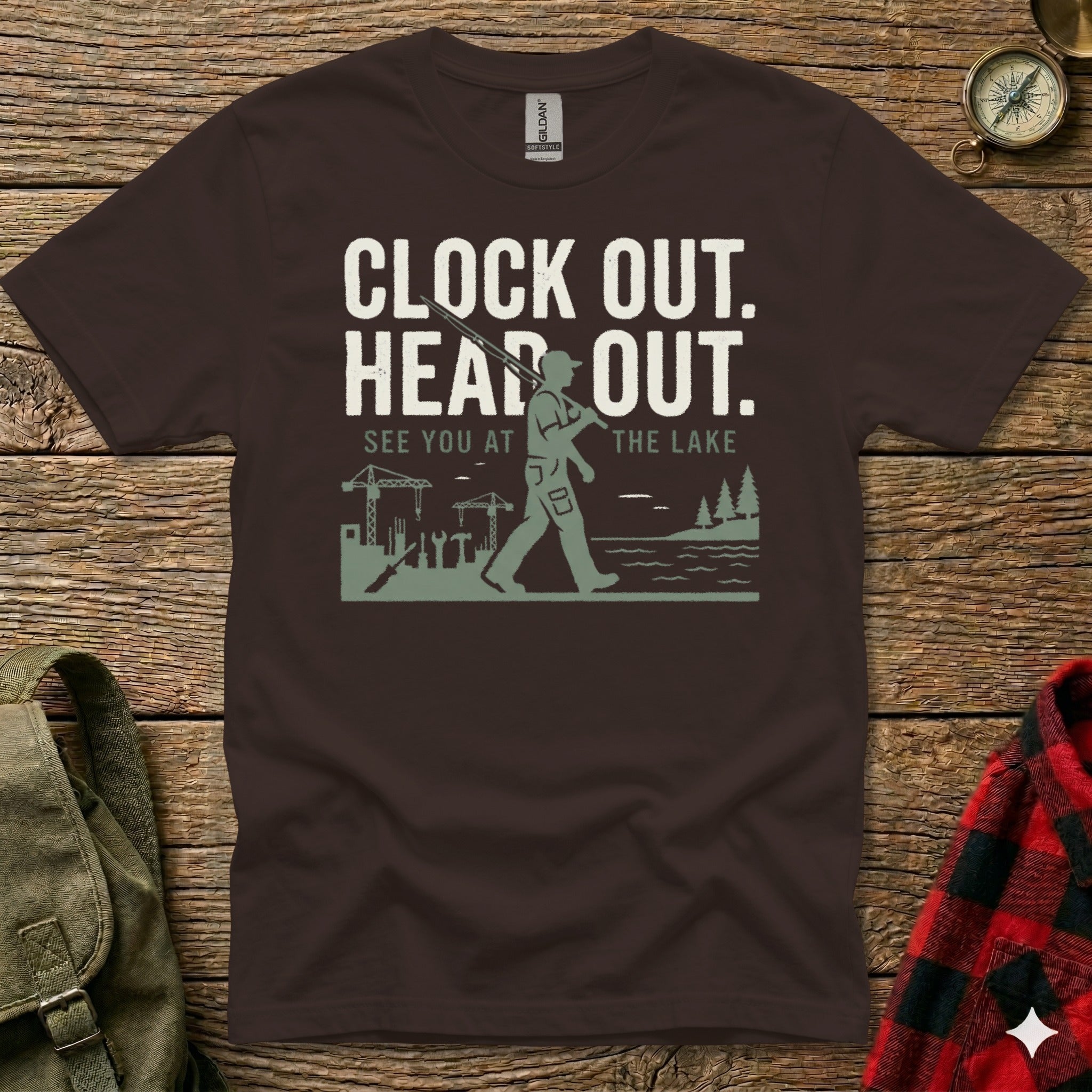 T-shirt with "Clock out. Head out. See you at the lake" text and graphic.
