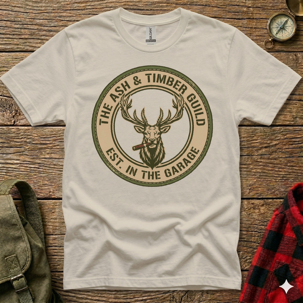Cream t-shirt with "Ash & Timber Guild Est. in the Garage" circular logo featuring a stag.
