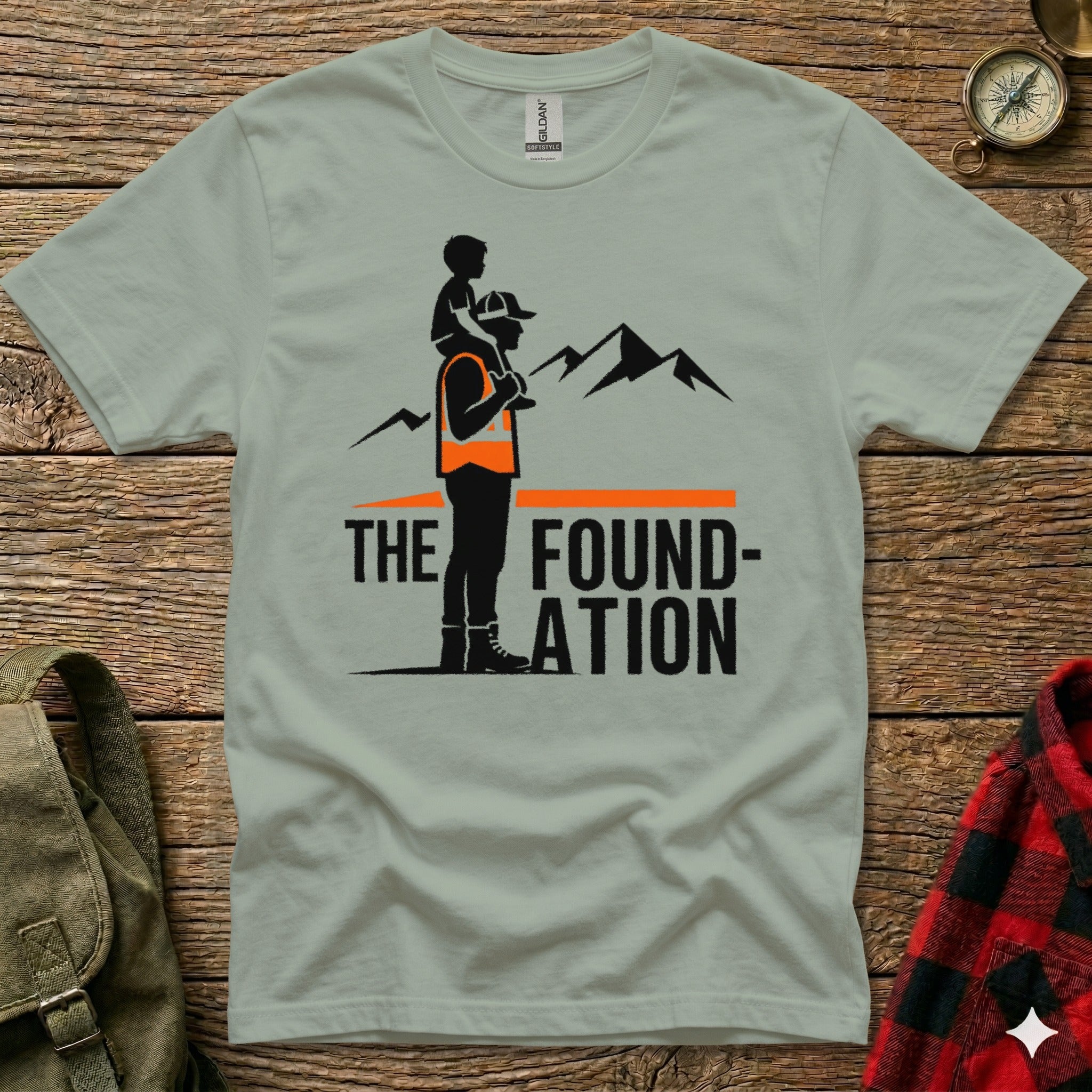 Gray t-shirt with "THE FOUNDATION" text and mountain graphic.