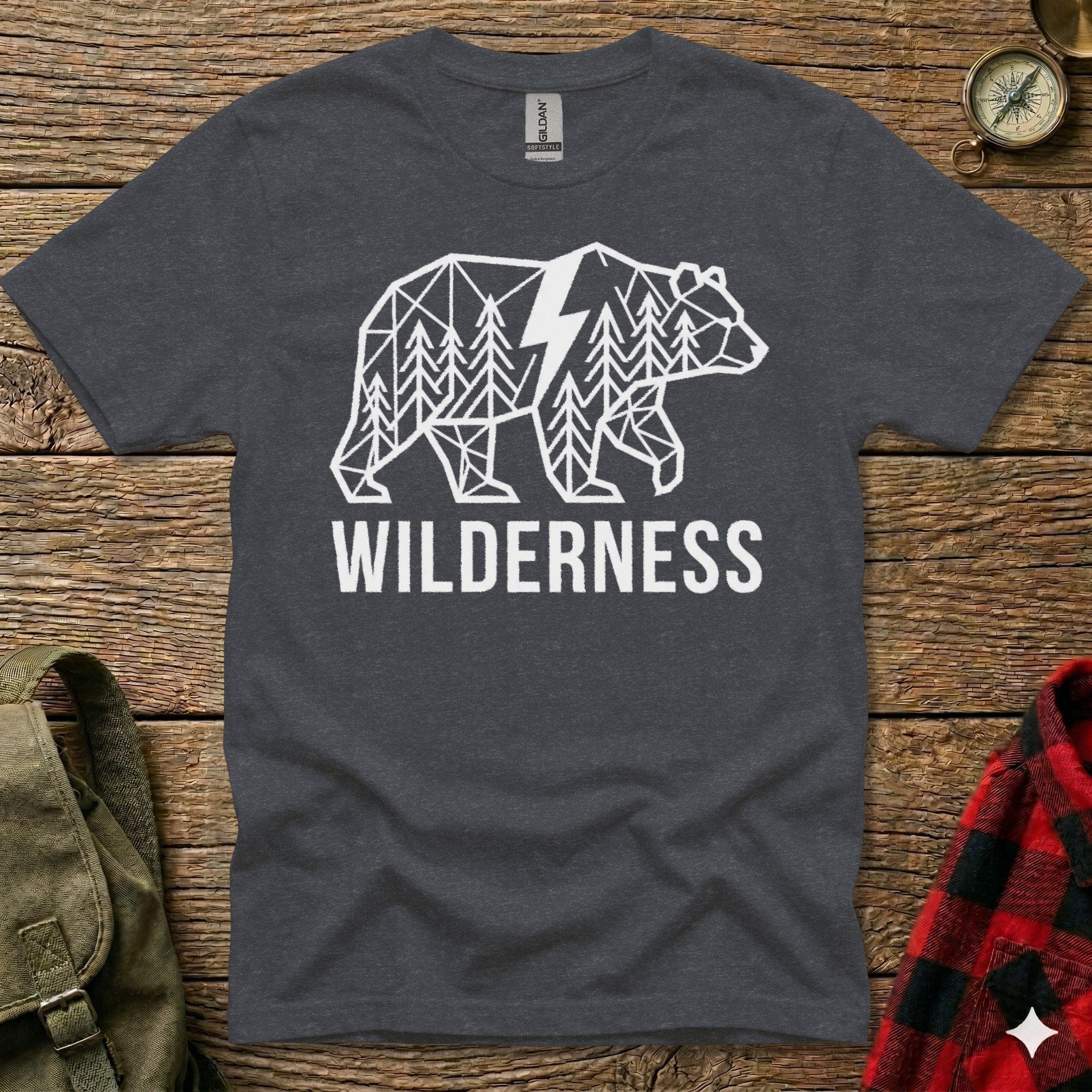 Dark gray t-shirt with a white geometric bear and forest design and the word WILDERNESS.