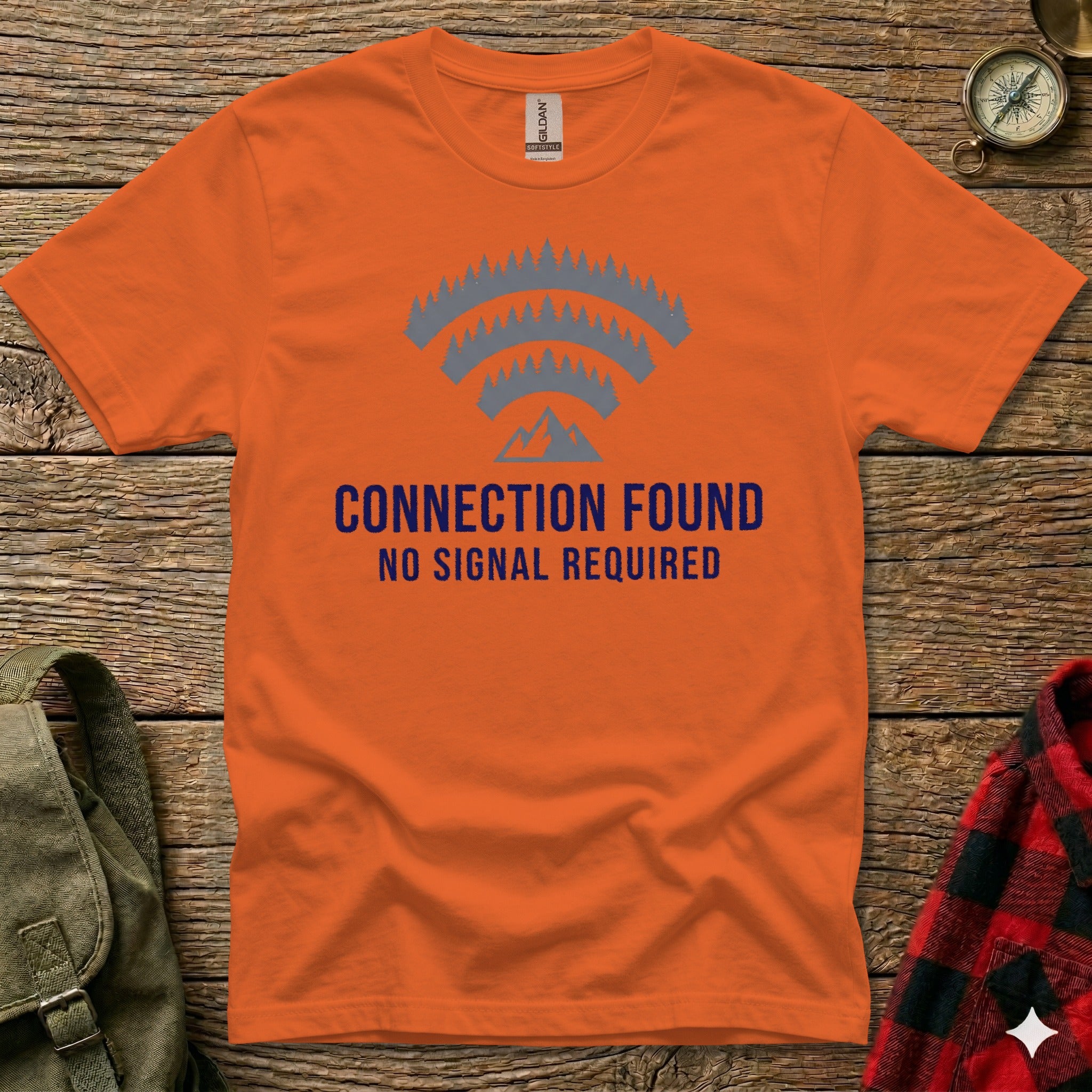 Orange t-shirt with "CONNECTION FOUND NO SIGNAL REQUIRED" and mountain graphic.