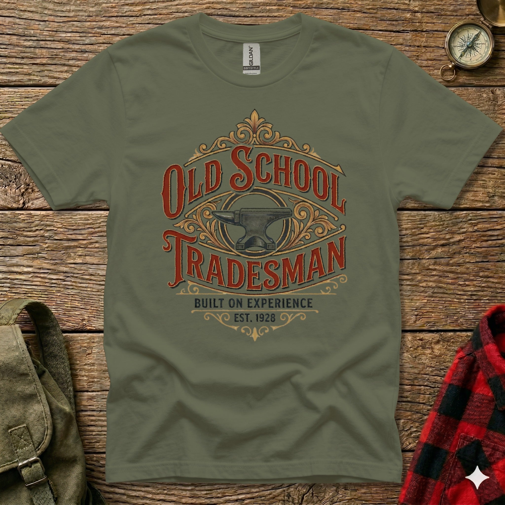 Olive green t-shirt with "Old School Tradesman Built On Experience Est. 1928" text and anvil graphic.