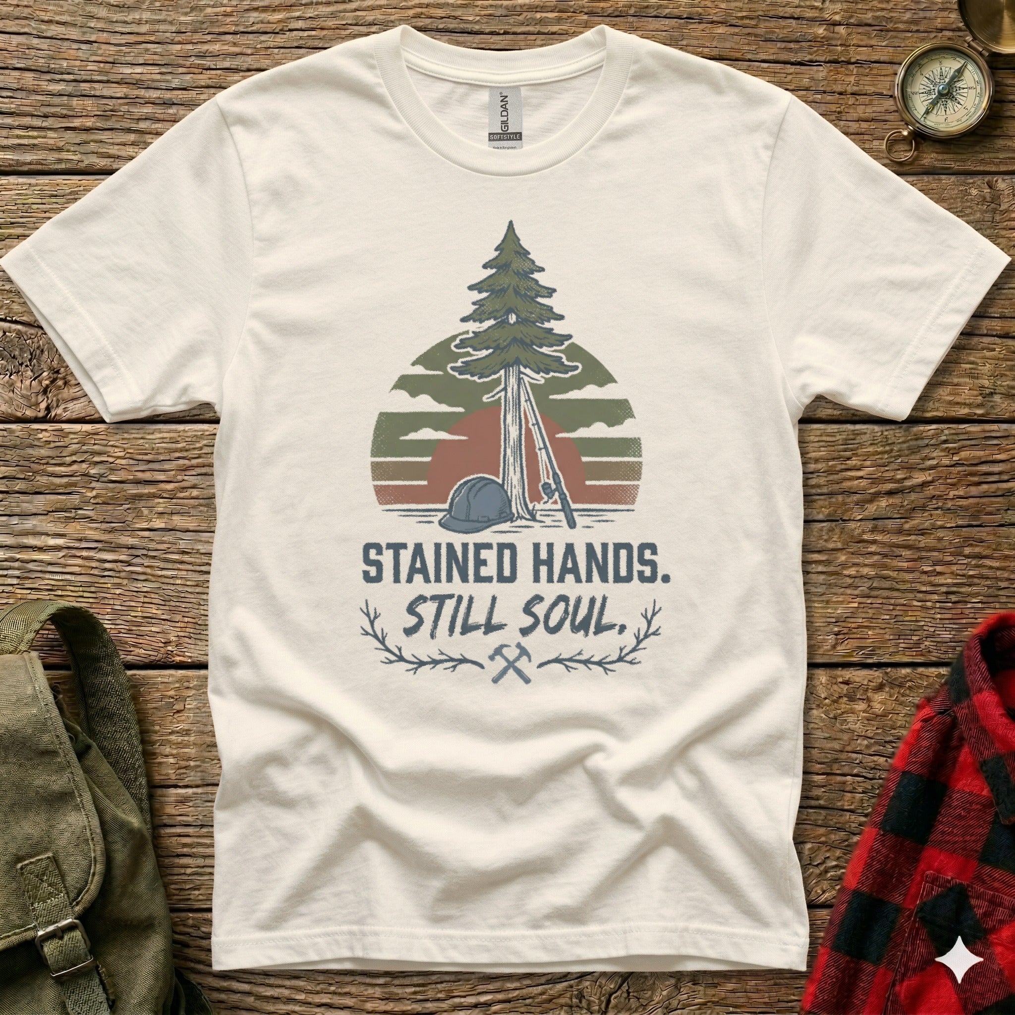 White t-shirt with forest and text "STAINED HANDS. STILL SOUL."
