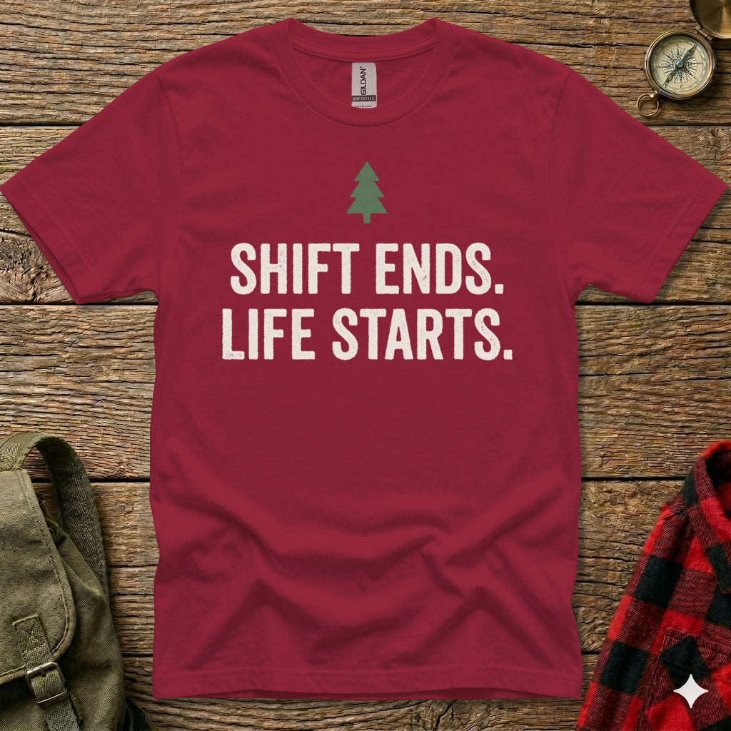 Burgundy t-shirt with white text "SHIFT ENDS. LIFE STARTS." and a small green tree.