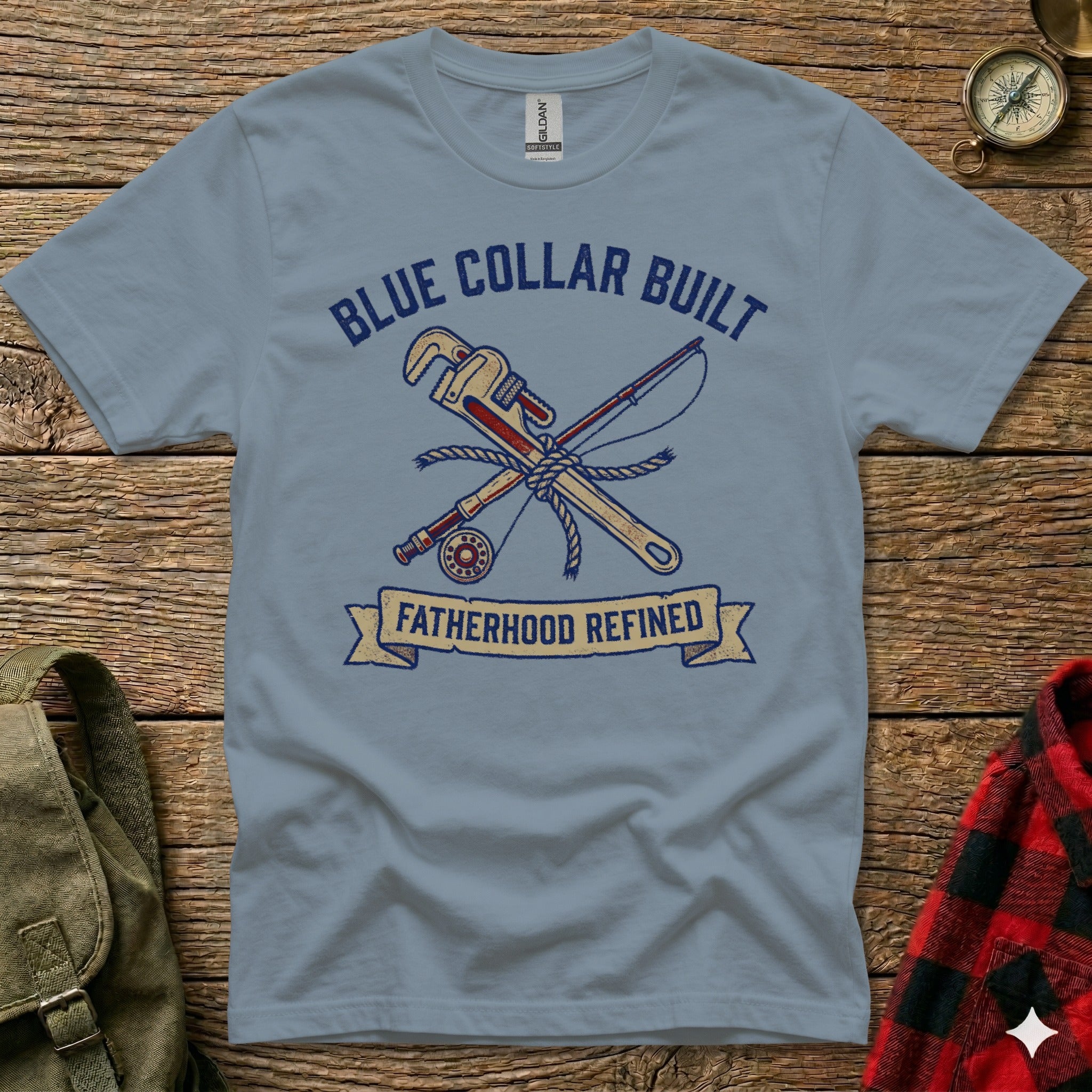 Blue t-shirt with "Blue Collar Built Fatherhood Refined" text and crossed tools.