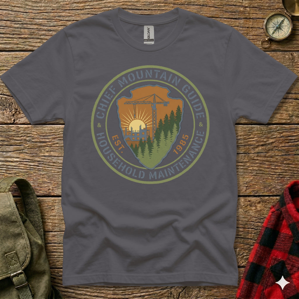 T-shirt graphic with "Chief Mountain Guide Household Maintenance" logo and 1985 establishment date.