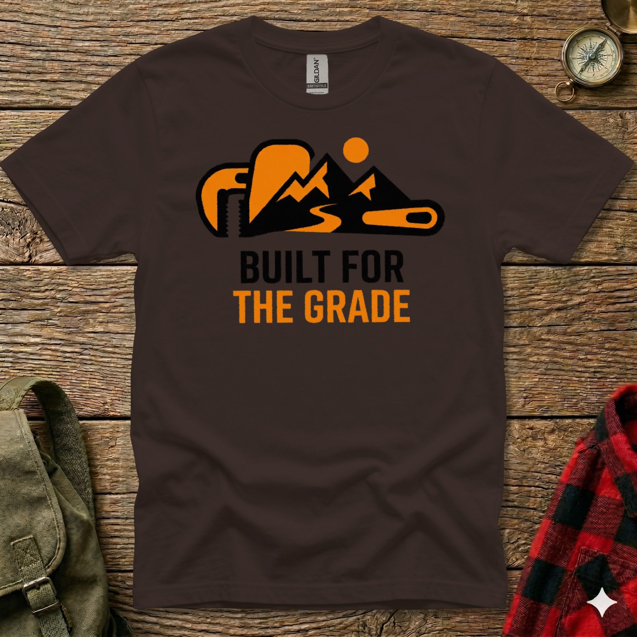 Brown t-shirt with orange mountain graphic and text "BUILT FOR THE GRADE".