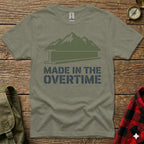 Green t-shirt with mountains and "Made in the Overtime" text.
